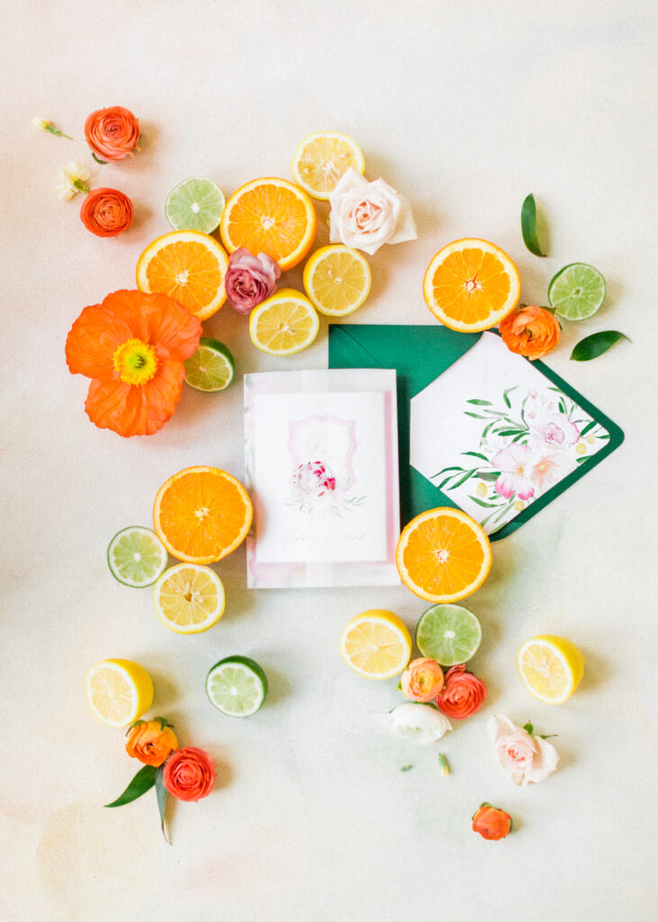 citrus wedding invitations - custom watercolor wedding stationery with a monogram crest and pink lemonade twist! By Ashley triggiano - as featured on style me pretty