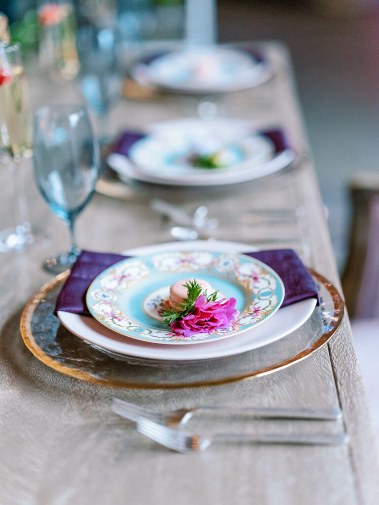 pink purple and blue wedding place setting