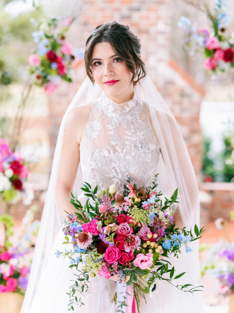 bride with purple and pink bouquet