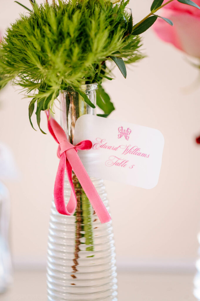 custom place cards on bud vase with flowers