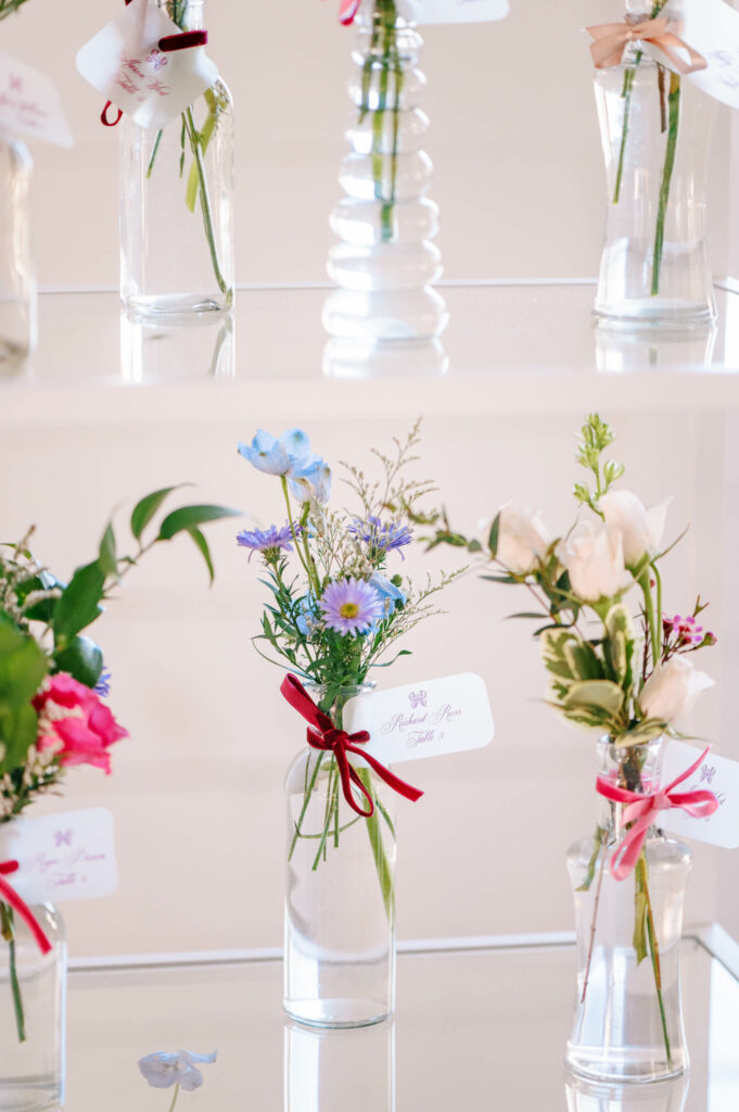 custom place cards on bud vase with flowers