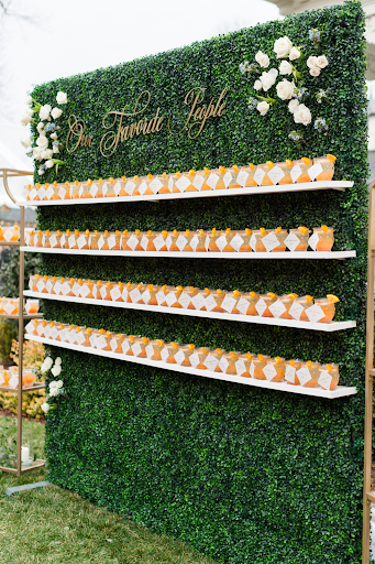 boxwood seating chart at wedding with custom cocktails with place cards