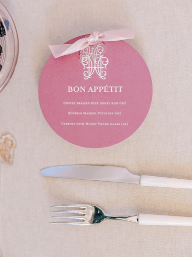 unique stationery circular wedding menu with acrylic monogram charm