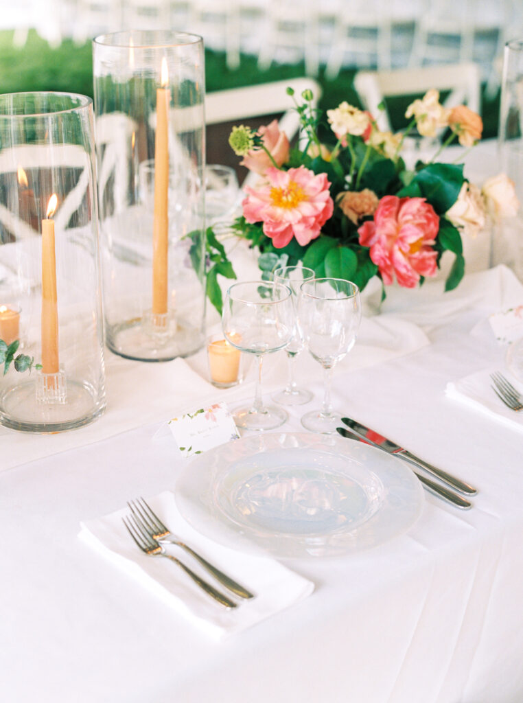 wedding place setting with floral centerpiece and custom escort card