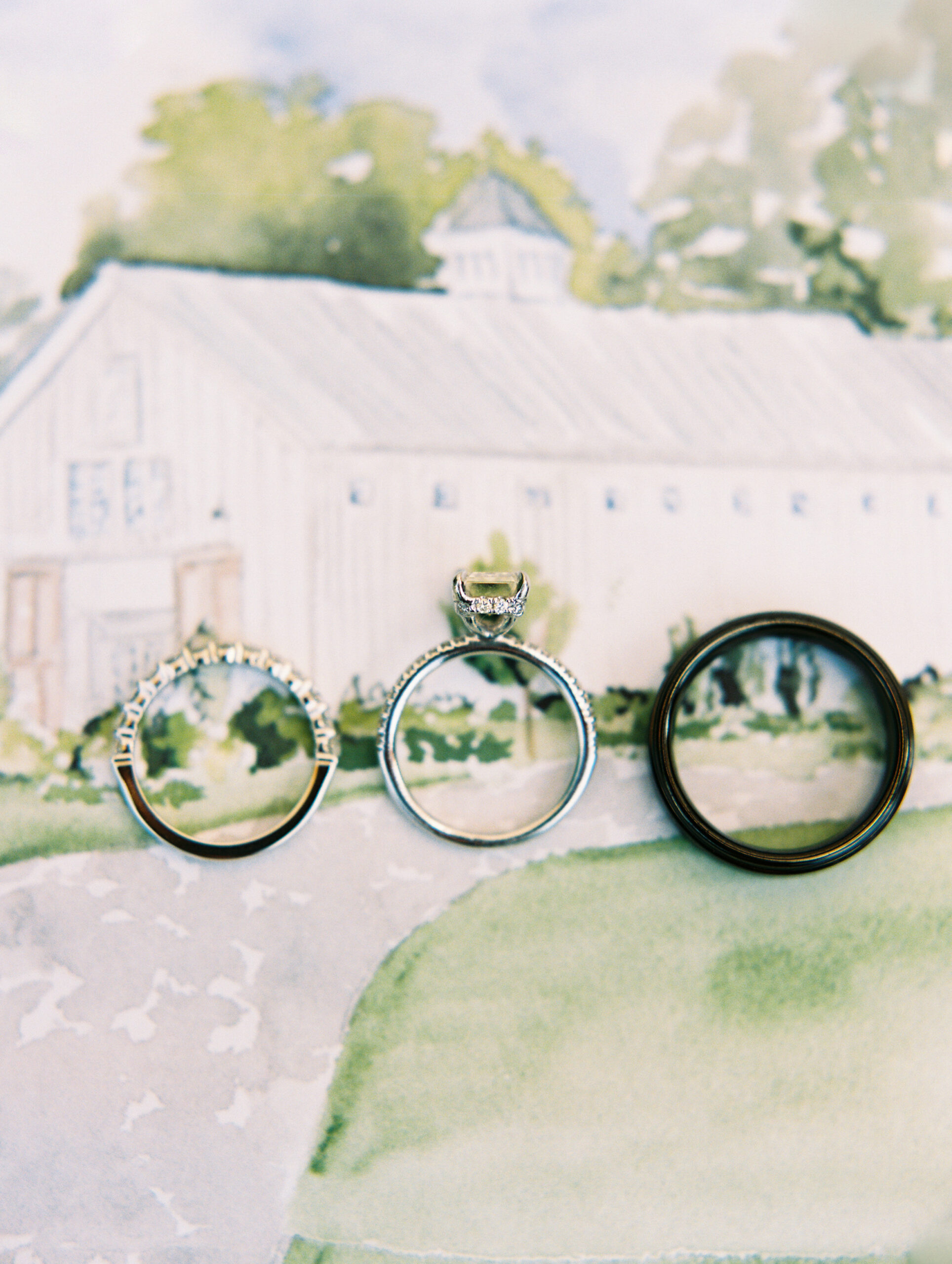 ring shot flat lay on top of barn of chapel hill watercolor painting