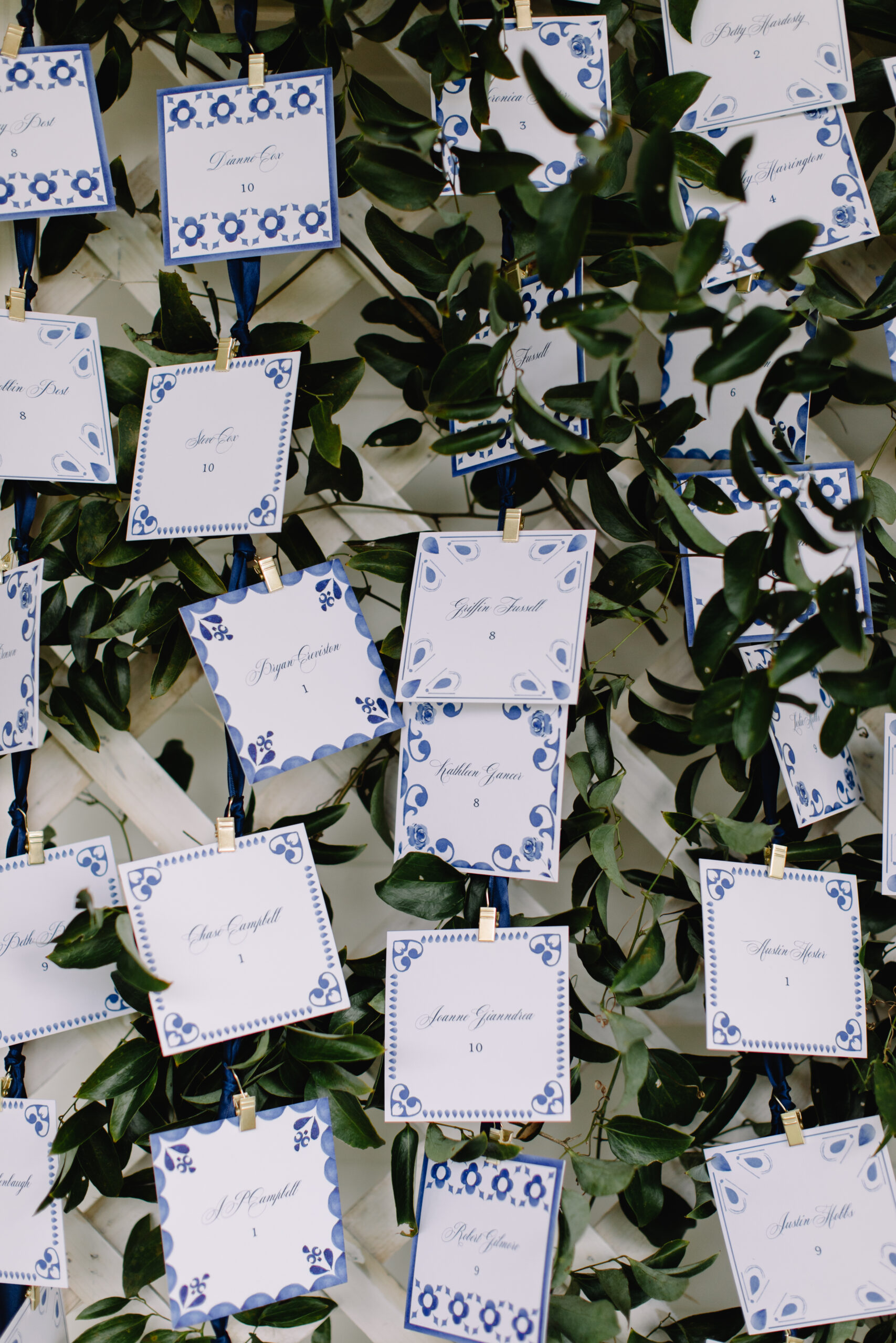 blue and white escort cards for a wedding