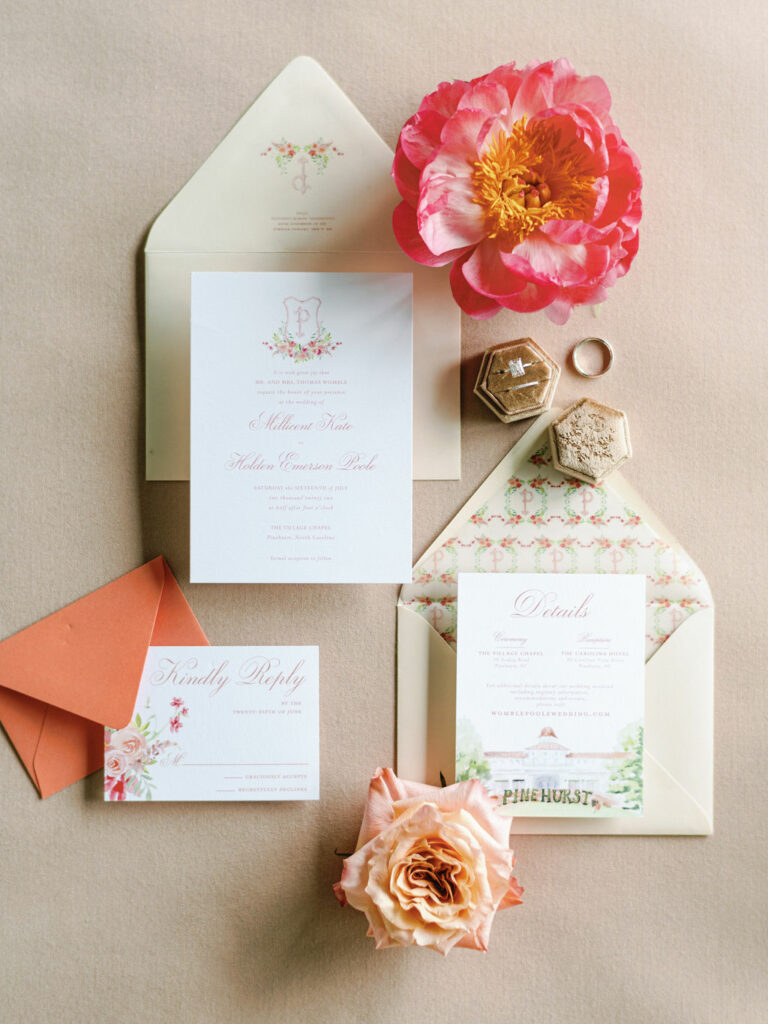 Flat lay photo of watercolor monogram wedding invitation suite for Pinehurst resort wedding