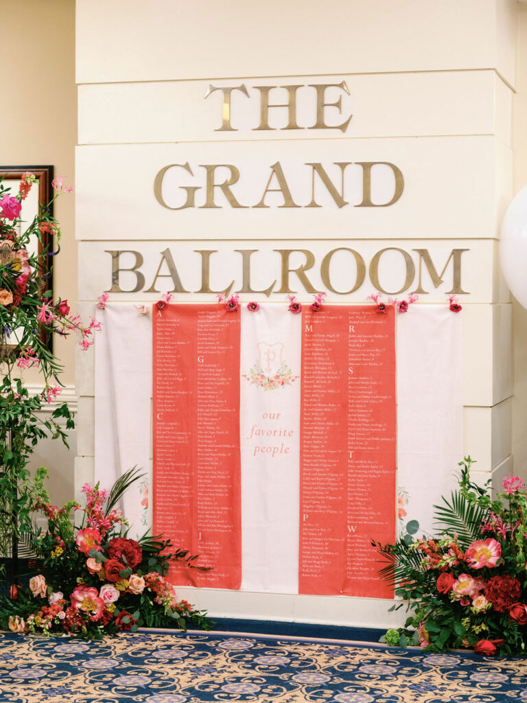 Orange and cream fabric hanging seating chart for Pinehurst resort wedding