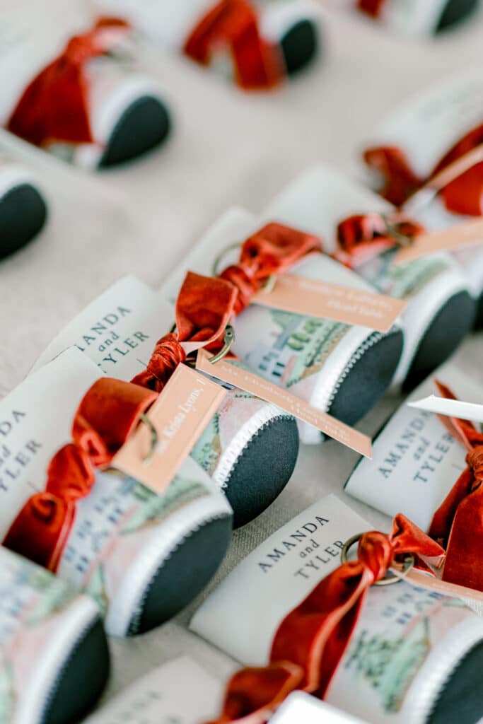 watercolor venue koozies with velvet ribbon