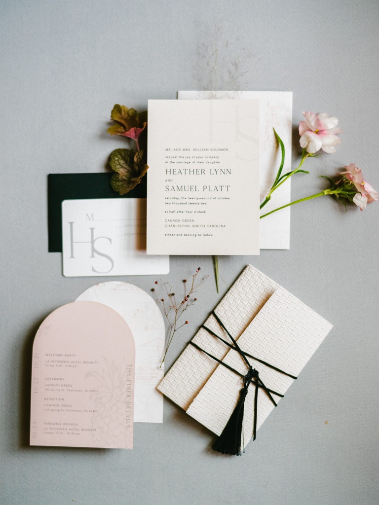 Modern white, black, and pink wedding invitation suite