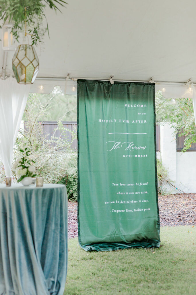 green fabric wedding welcome sign