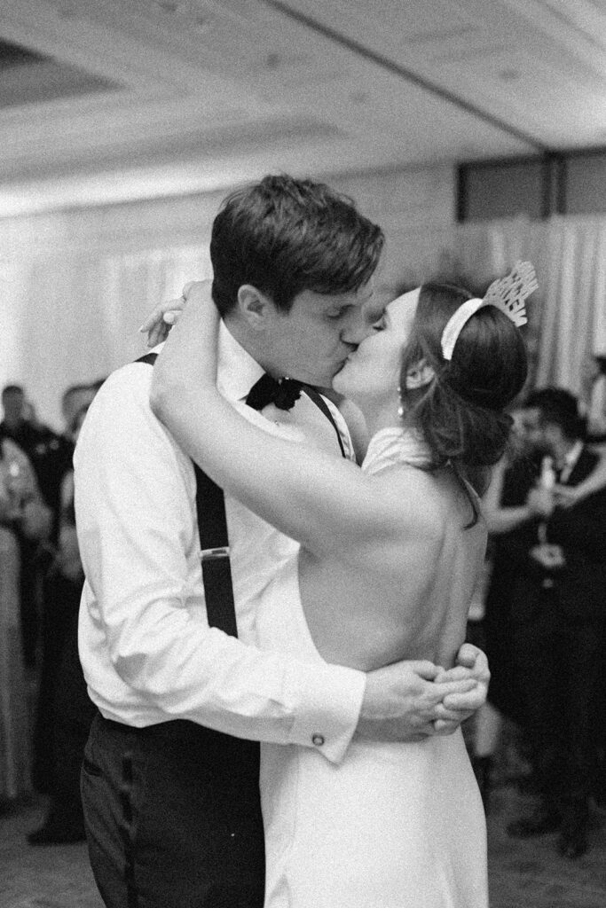 bride and groom kiss on their New Year's Eve wedding 