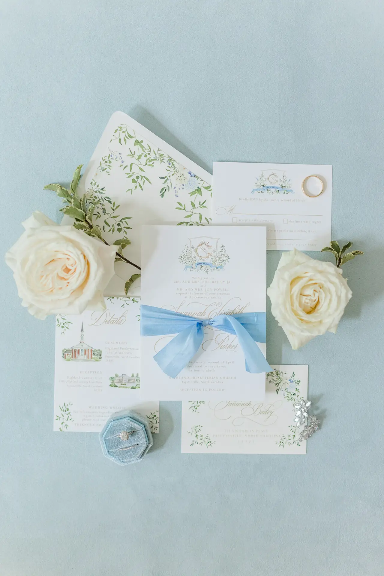 wedding suite featuring watercolor crest