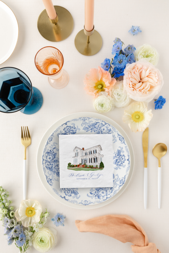 cocktail napkin with watercolor illustration of merrimon-wynne on a blue and white ginger jar wedding plate