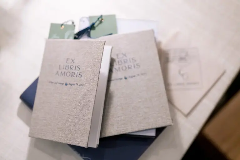 linen covered dinner menu books at Washington duke rehearsal dinner with bookmarks on table