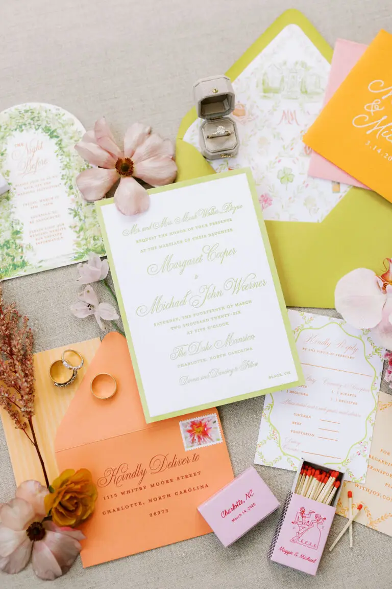 colorful orange and lime green chartreuse wedding invitations at duke mansion on tan background